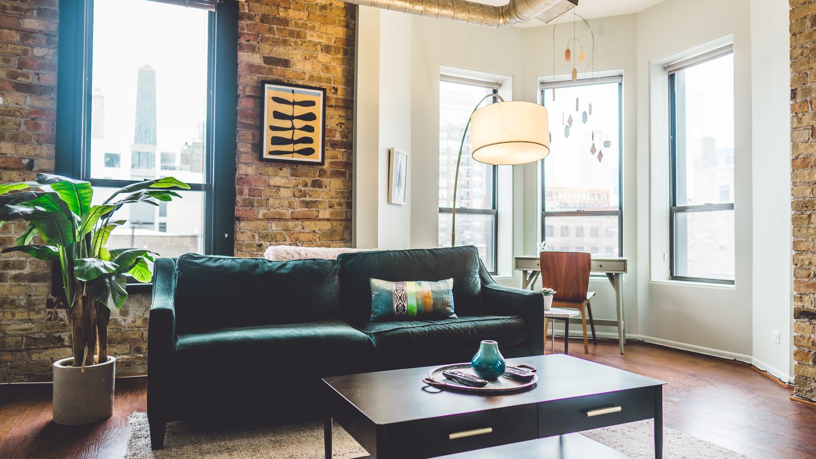 Seating area with an upholstered sofa, layered textiles, and warm tones