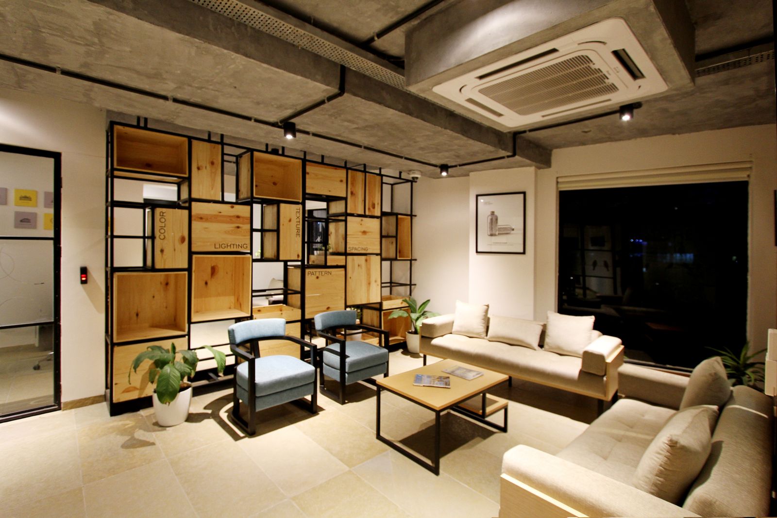Open-plan interior with living and dining zones in warm neutrals