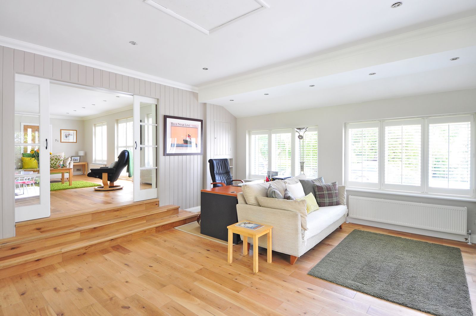 Entryway with a console table, mirror, and warm lighting