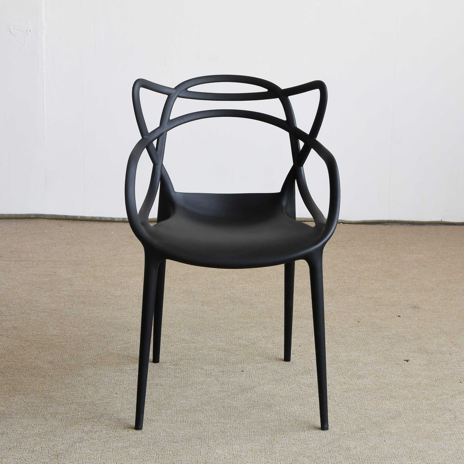 Styled furniture vignette with chair, table, and home accents