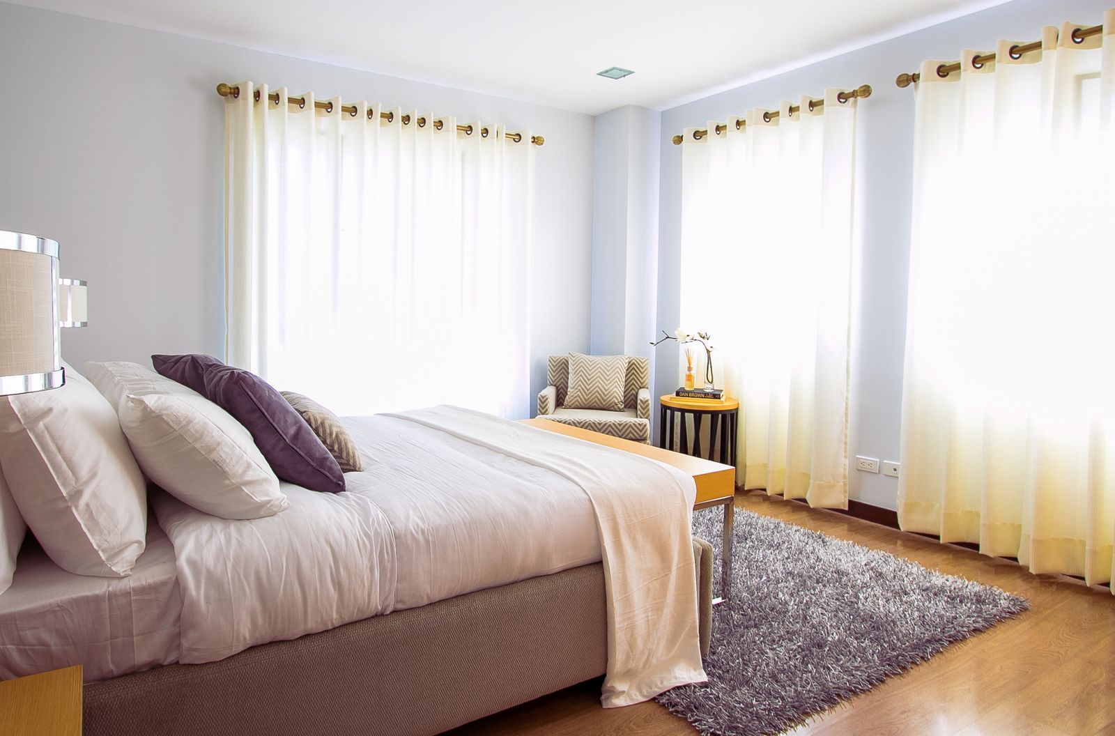 Serene bedroom with upholstered bed and natural linen bedding