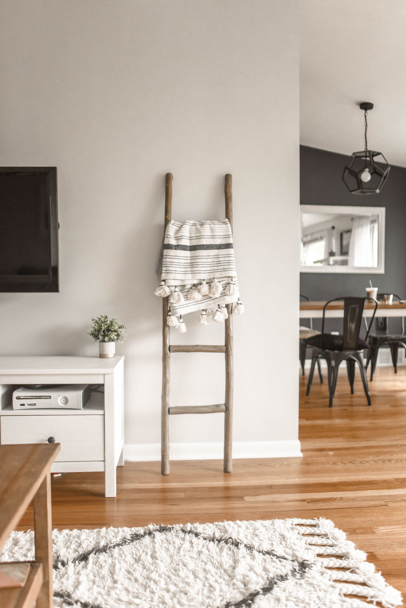 Entryway with console table, mirror, and warm lighting